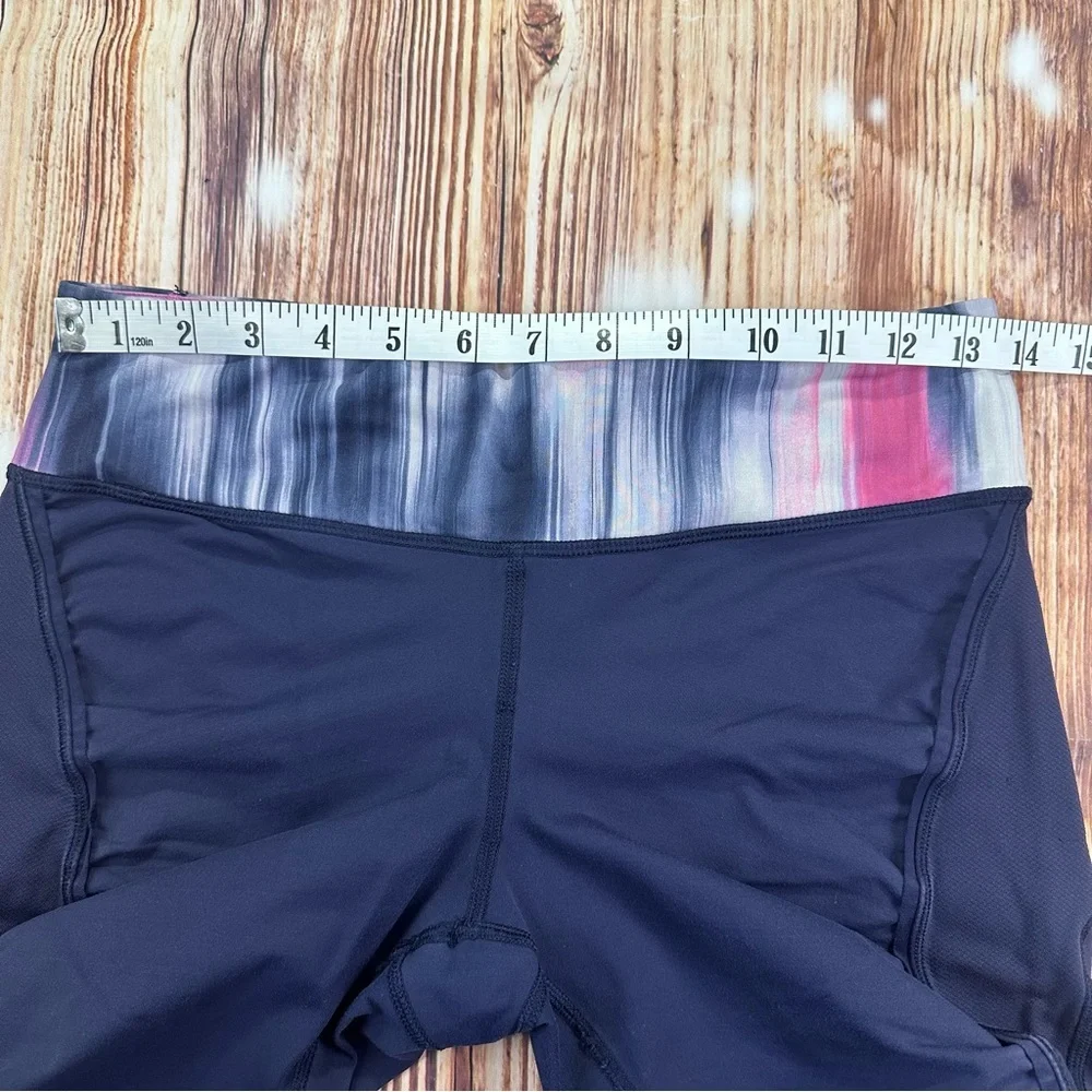 Lululemon Dark Navy ,colorful waist ban and slightly cropped leggings Size 8.